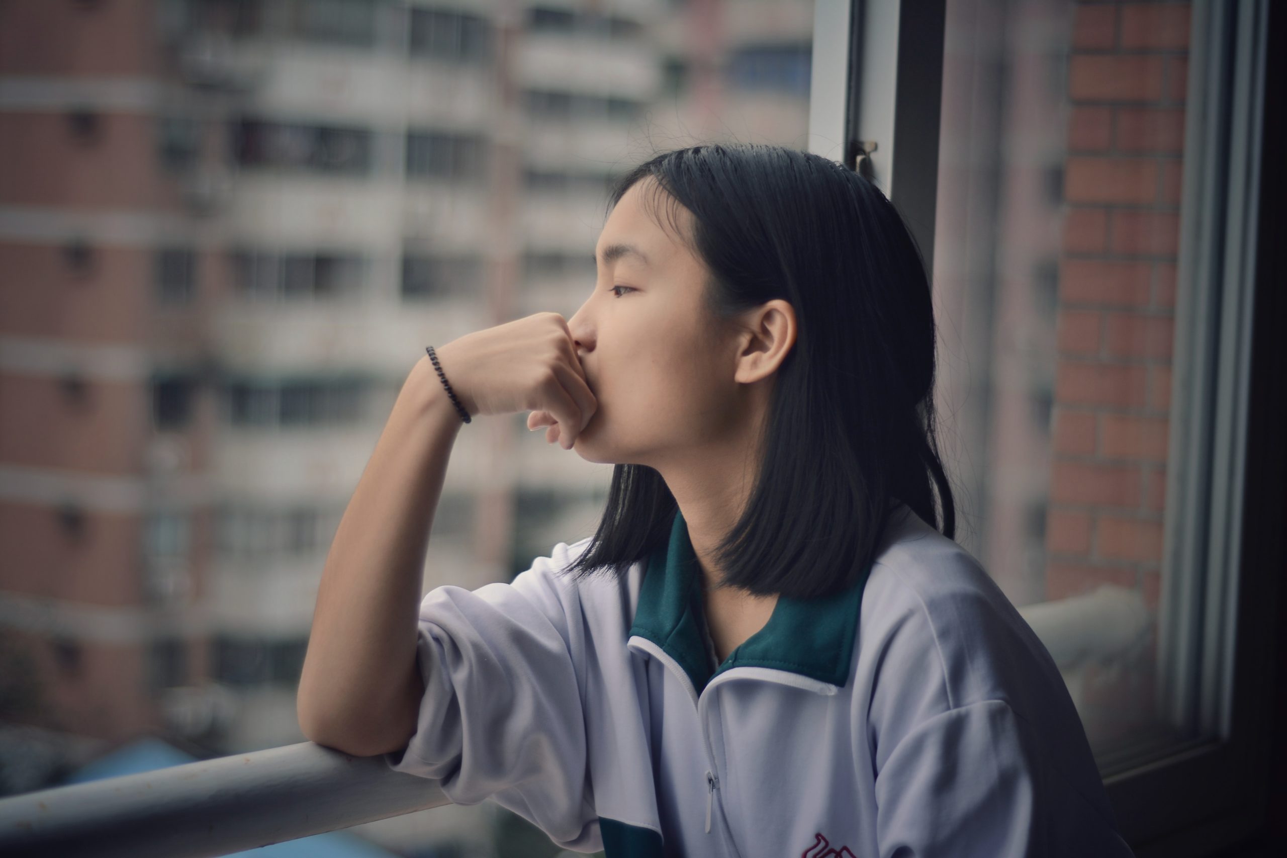 woman-thinking-in-the-balcony